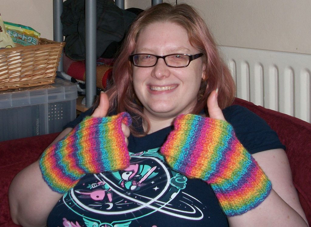 Mercury wearing Knit the Rainbow Mitts.